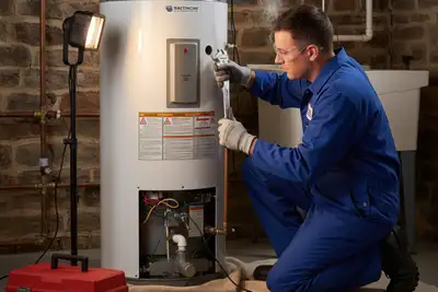 Baltimore technician performing professional water heater repair with tools and equipment in Baltimore, MD